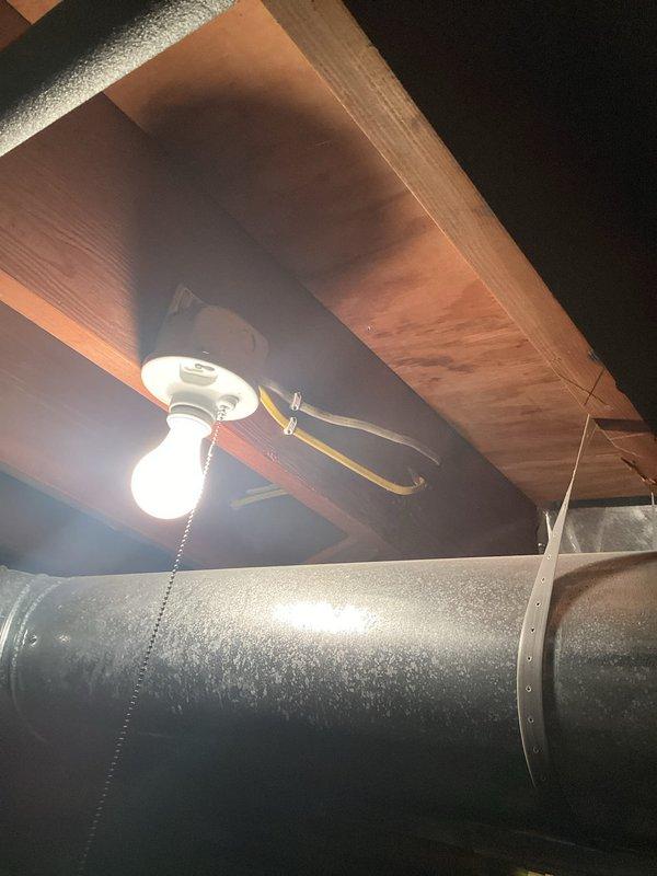 Conducted on-site assessment for installation of two light fixtures in basement area. Evaluated existing ceiling structure with exposed wooden beams and joists to determine optimal mounting locations and electrical routing. Documented current conditions including one existing ceiling fan with light fixture and one single-bulb ceiling-mounted fixture, both with pull-chain operation. Assessed proximity to large metallic HVAC ductwork running horizontally through the space to ensure proper clearance for new fixture installations. Inspected electrical access points and determined feasibility for extending circuits to accommodate additional lighting fixtures. Provided comprehensive estimate for labor and materials required to complete the installation work.