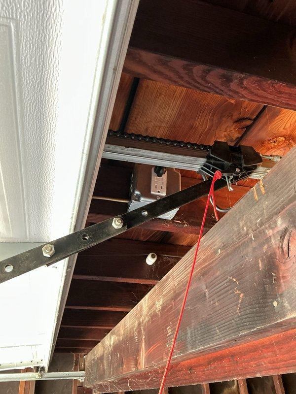 Returned to address garage door opener issue from previous service visit. Inspected Linear brand garage door opener installation, verified proper mounting to ceiling joists, and checked electrical connections and wiring routing. Tested opener operation and manual release mechanism to ensure system functioning correctly. Resolved previous concern and confirmed garage door opener operating as intended.