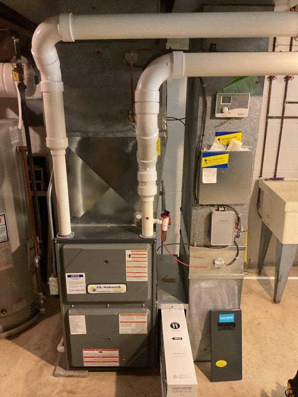 Completed comprehensive cooling system maintenance on residential HVAC unit located in basement mechanical room. Performed standard preventative maintenance procedures including inspection of furnace, air handler, ductwork, and associated components. All equipment found to be operating within normal parameters, and system documentation was photographed for service records.