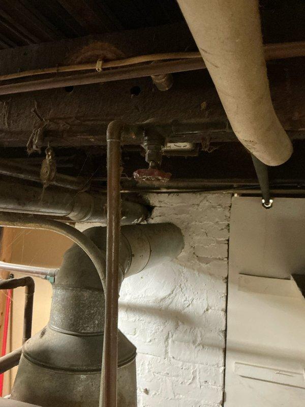 Conducted comprehensive assessment of 40-year-old residential boiler system currently operating at partial capacity. Evaluated existing infrastructure including distribution piping, ductwork, and electrical connections in basement utility area, documented equipment condition through detailed photography, and presented replacement options to address aging system's declining performance and reliability concerns.