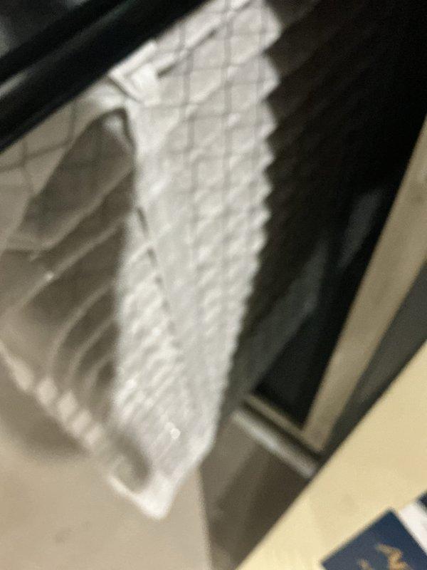Completed routine cooling system maintenance inspection. Examined and documented air filtration components including honeycomb-pattern air filter and Premier air scrubber unit with integrated HVAC air quality system. All components found in serviceable condition with proper installation and operation confirmed.