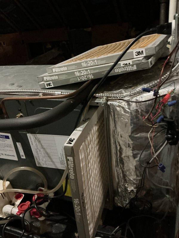 Completed comprehensive air conditioning maintenance and tune-up on residential HVAC system with air handler located in attic space. Performed standard preventive maintenance procedures including filter inspection, system operation verification, and visual equipment assessment. Unit operational with 3M Filtrete filters properly staged for replacement, condensate pump and drain pan functioning correctly, and all electrical connections secure.
