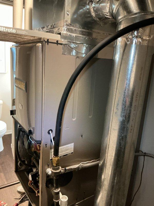 Completed comprehensive heating and cooling tune-up on Luxaire air handler system located in attic space. Performed standard maintenance protocol including filter inspection, verified proper operation of gas valve assembly and condensate drainage system, and confirmed all ductwork seals and connections were secure with no air leakage detected.