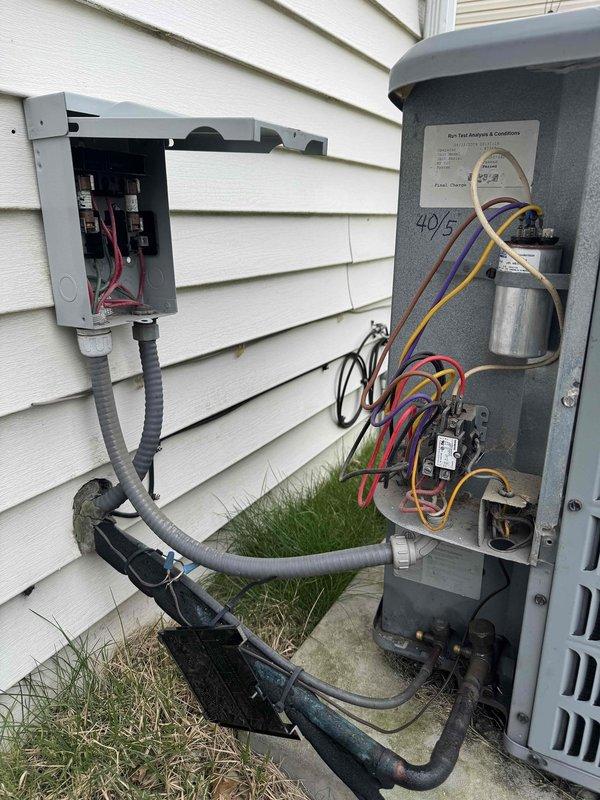 Completed comprehensive heating and cooling maintenance on dual HVAC systems. Performed thorough inspection of outdoor condensing units, verified electrical connections and components including capacitors and contactors, checked refrigerant line connections, and confirmed proper operation of disconnect boxes and control wiring. All systems tested and found operating within normal parameters upon completion of preventive maintenance service.