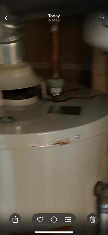 Performed routine maintenance on residential tanked water heater system. Inspected all plumbing connections, copper supply lines, and shut-off valves for proper operation and signs of wear. Verified expansion tank mounting and pressure settings, examined gas line connections and safety controls, and assessed overall unit condition including checking for rust or corrosion on tank exterior.