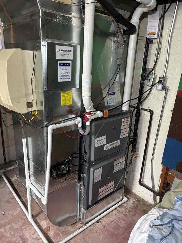 Completed full A/C and coil installation, replacing existing system with new Daikin equipment. Installed new outdoor condensing unit on existing concrete pad with proper refrigerant line connections and service valves. Indoor evaporator coil integrated with existing furnace system, with all PVC drainage and refrigerant lines properly routed and secured. System tested and operational. Removed old condenser unit and transported to Valley View Daikin facility for warranty processing on same day per manufacturer requirements.