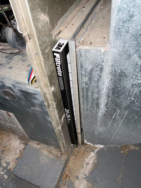 Completed full system evaluation for HVAC replacement estimate at residential property. Assessed existing furnace unit and associated ductwork in basement utility area, documenting current equipment condition including significant wear, dirt accumulation, and aging components. Verified equipment specifications from manufacturer labels, checked system levelness and installation alignment, and photographed existing 20x25x1 filter size configuration for replacement system planning.