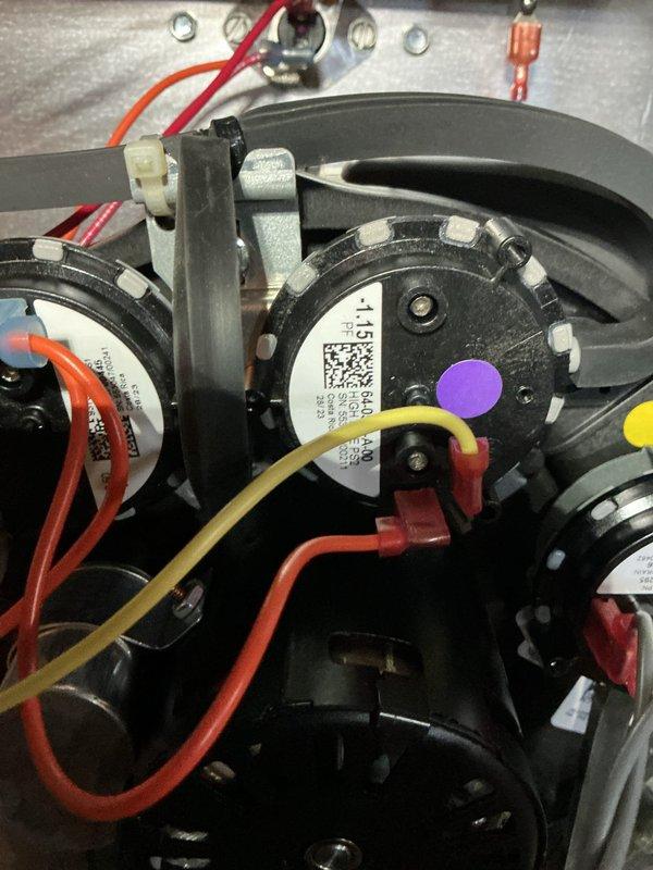 Responded to follow-up no heat call where previous technician had visited. Accessed HVAC system in basement utility area and inspected blower assembly and motor components. Verified all electrical connections at blower motor terminals, checked wire integrity including red, yellow, orange, and white conductor connections, and confirmed proper motor mounting and mechanical operation. System evaluated and documented with photos showing blower assembly and basement infrastructure access point.