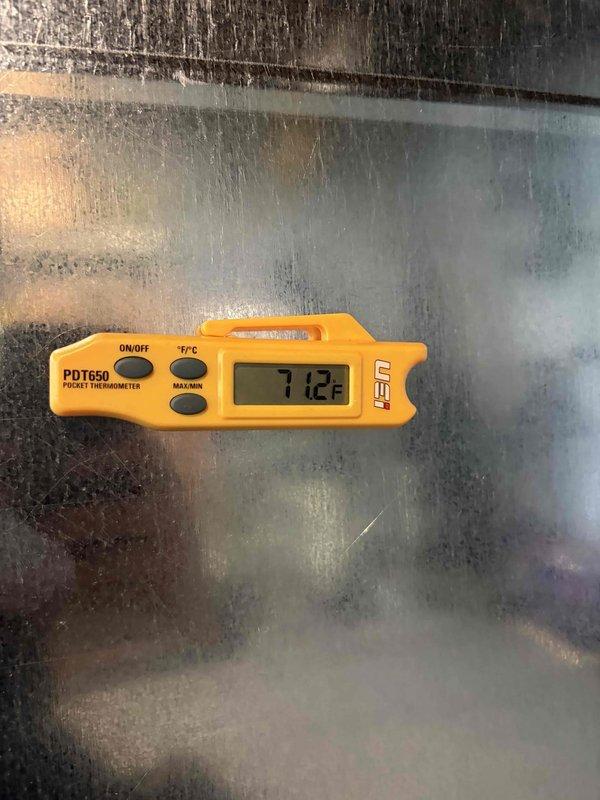 Completed full HVAC system installation including 96% high-efficiency furnace, air conditioning unit, and ductwork with insulated liner. System commissioning verified proper airflow with supply air temperature of 43.6°F and return air temperature of 71.2°F, confirming adequate cooling capacity and temperature differential. All components tested and operational, with condensation on evaporator coil indicating normal system function.
