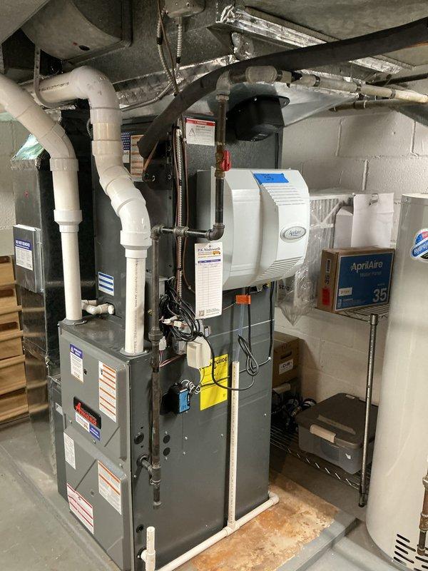Completed first-year heating maintenance on Amana heat pump system as part of MVP preventive maintenance program. Performed comprehensive inspection of outdoor condenser unit and indoor air handler components, verified refrigerant lines and electrical connections, checked humidification system operation, and documented equipment condition through photographic records. All system components found operating within manufacturer specifications with no deficiencies noted.