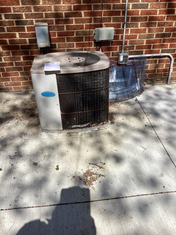 Conducted site assessment of existing outdoor AC condenser unit for relocation and reinstallation. Customer requires unit to be temporarily removed and relocated to accommodate concrete pad replacement and re-pouring work. Documented current installation configuration including electrical connections, conduit routing, and positioning against exterior brick wall. Unit is currently mounted on weathered concrete pad with electrical disconnect boxes and conduit properly installed on wall. Provided quote for disconnection, removal, temporary protection during concrete work, and reinstallation of condenser unit once new pad is cured and ready for equipment placement.