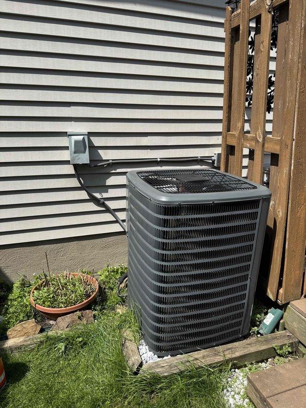 Completed routine cooling maintenance on residential HVAC system with outdoor condenser unit and indoor furnace. Performed standard seasonal inspection, cleaned condenser coils, checked refrigerant levels, tested system operation, and verified all components functioning properly in preparation for upcoming cooling season.