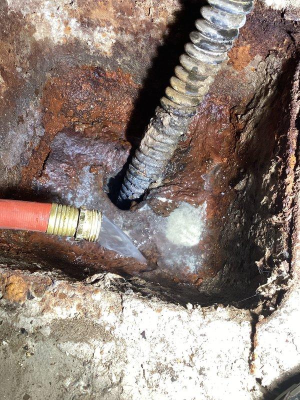 Performed routine maintenance on tanked water heater including complete system flush. Upon inspection, discovered significant sediment accumulation at tank bottom, which was successfully removed during drain and flush procedure. Unit exterior showed advanced corrosion and rust deterioration on metal surfaces, indicating age-related wear. Flushed system until water ran clear, removing mineral deposits and debris to restore optimal heating efficiency and extend equipment lifespan.