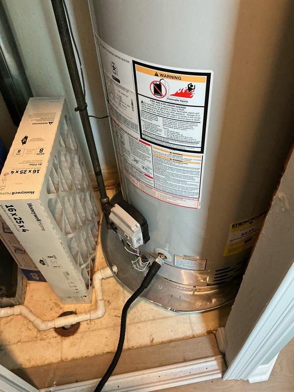 Completed annual maintenance visit for residential cooling system and hot water heater as part of scheduled preventative maintenance program. Performed comprehensive inspection of HVAC equipment panel, verified proper electrical connections and safety labeling compliance. Inspected water heater unit, confirmed operational status, checked temperature and pressure relief valve, and verified all manufacturer warning labels present. Replaced air filter with new unit to maintain optimal airflow and system efficiency.