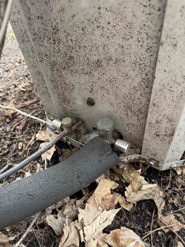 Completed HVAC cooling maintenance tune-up on residential system. Inspected outdoor disconnect box and fuses, verified electrical connections and conduit routing, and examined condensing unit installation at exterior location. All components found in normal working condition with system ready for cooling season operation.