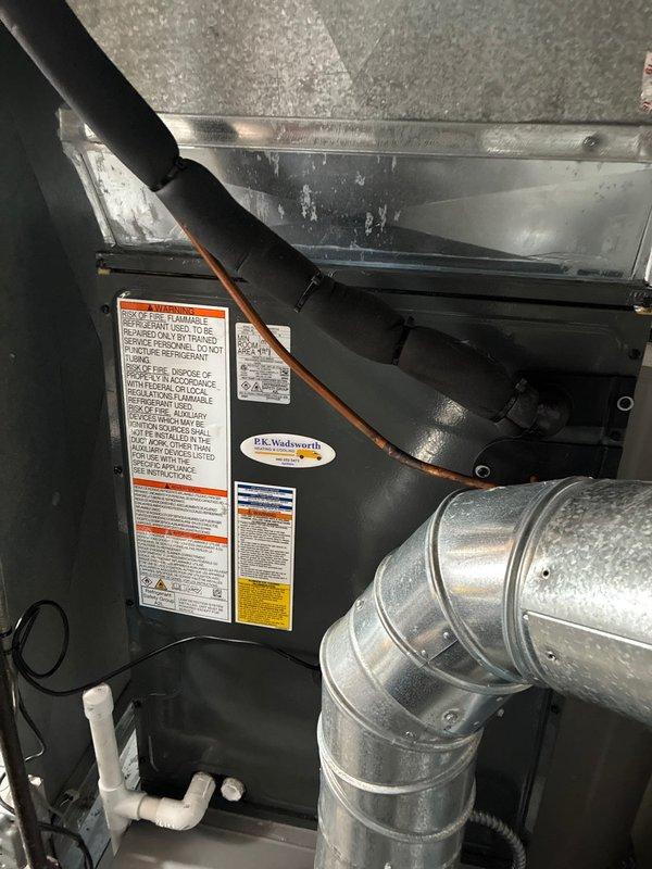 Completed installation of new air conditioning system including air handler unit in attic space with proper ductwork connections and refrigerant line routing to basement area. System was tested and verified operational with all components properly labeled and secured per manufacturer specifications.