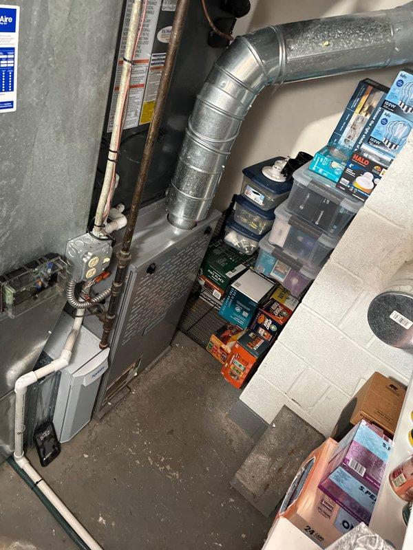 Completed installation of new air conditioning system including air handler unit in attic space with proper ductwork connections and refrigerant line routing to basement area. System was tested and verified operational with all components properly labeled and secured per manufacturer specifications.