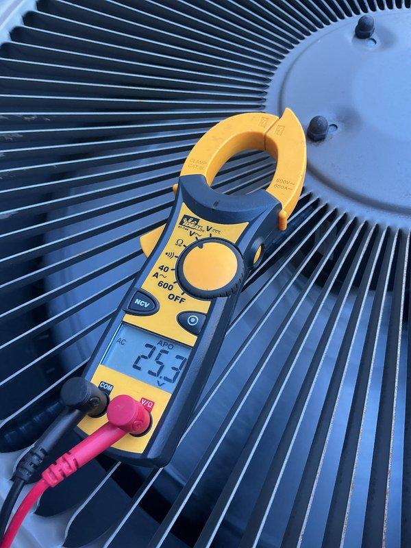 Performed routine preventative maintenance on residential cooling system. Inspected condensate drain line and connections, verified proper drainage flow. Measured and recorded compressor amperage at 23.3 amps using clamp meter, confirming unit operating within manufacturer specifications.