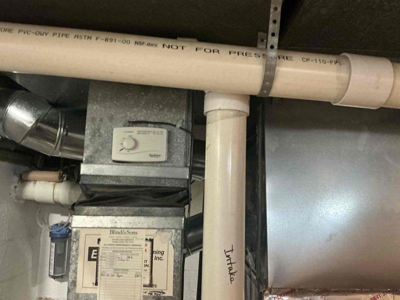 Conducted comprehensive estimate for full HVAC system replacement in mechanical utility area with existing Lennox furnace and associated ductwork. Evaluated current equipment configuration including furnace unit, supply and return ductwork with visible condensation issues, PVC drainage piping, and air distribution components. Presented multiple system replacement options to address aging equipment and moisture concerns on duct surfaces, with all components easily accessible for future installation.