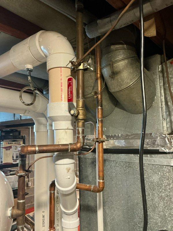 Provided AC replacement estimate for hail-damaged unit in residential basement setting with existing Carrier furnace system. Documented current equipment condition and HVAC infrastructure including ductwork, condensate drainage system, and associated components for insurance claim submission.