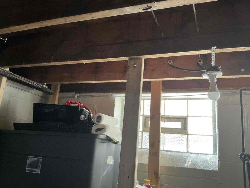 Completed full system replacement estimate for non-functional air conditioning unit. Provided three-tiered equipment options including GOOD level system with up to 13.4 SEER AC and 80% AFUE gas furnace, BETTER level system with up to 14 SEER AC and 96% AFUE gas furnace, and BEST level system with up to 16 SEER AC and 96% AFUE gas furnace. Assessed existing basement installation location with exposed ceiling joists and utility infrastructure to determine replacement requirements and equipment specifications.