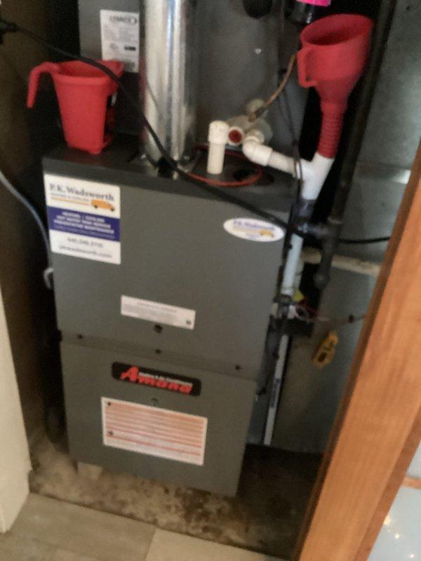 Performed routine maintenance on residential HVAC cooling system, inspecting furnace unit, refrigerant lines, and associated plumbing connections. Verified all components were operating within normal parameters, with equipment showing standard wear consistent with regular use.