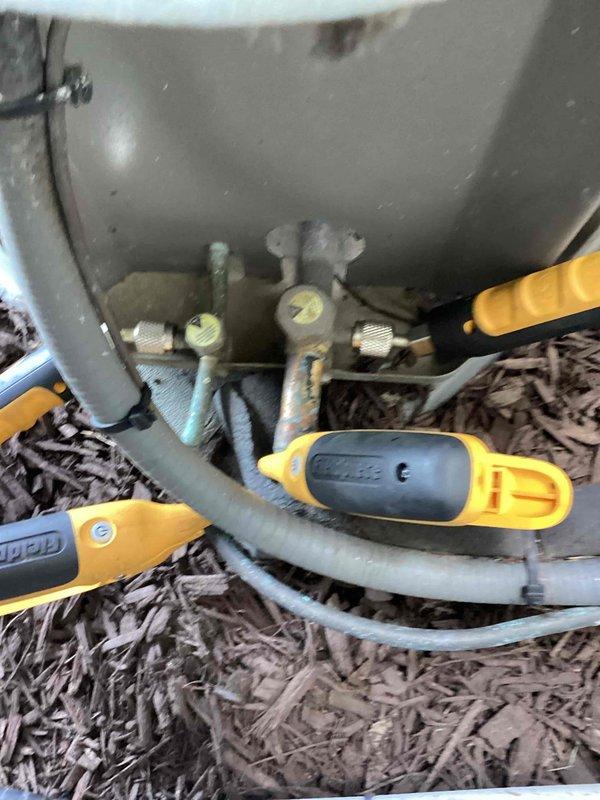 Performed routine maintenance on residential HVAC cooling system, inspecting furnace unit, refrigerant lines, and associated plumbing connections. Verified all components were operating within normal parameters, with equipment showing standard wear consistent with regular use.