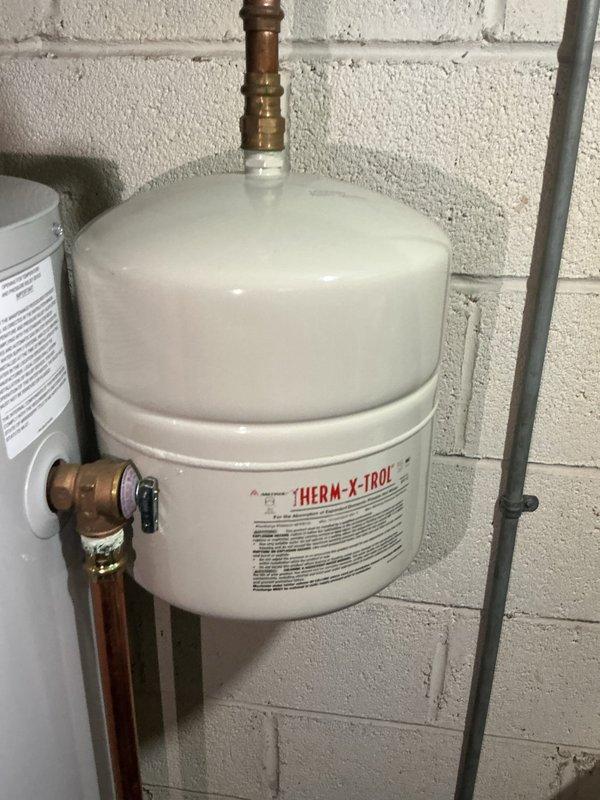 Performed routine maintenance on tanked water heater system, including complete flush to remove sediment buildup and ensure optimal performance. Inspected all plumbing connections, expansion tank, pressure relief valve, and associated copper piping; all components found in proper working condition with no signs of corrosion or leaks.