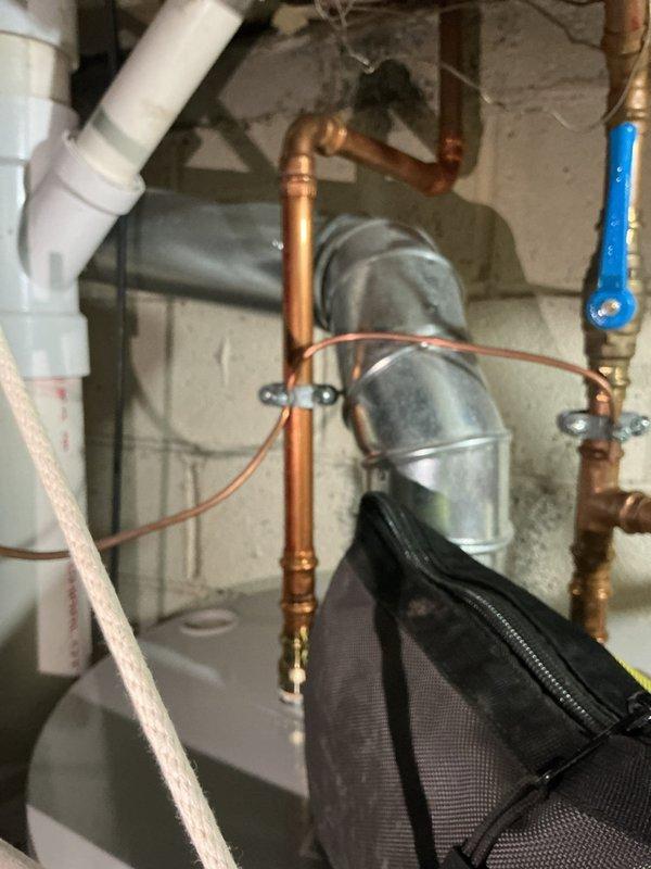 Performed routine maintenance on tanked water heater system, including complete flush to remove sediment buildup and ensure optimal performance. Inspected all plumbing connections, expansion tank, pressure relief valve, and associated copper piping; all components found in proper working condition with no signs of corrosion or leaks.