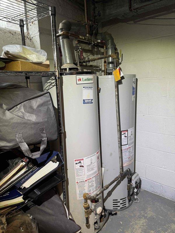 Performed routine HVAC heating system maintenance on one of two systems present at the property. Inspected air handling unit, verified proper filter installation and condition, and documented equipment status including Lochinvar water heating equipment and associated mechanical components. All accessible system components were checked and found to be operating within normal parameters at time of service.