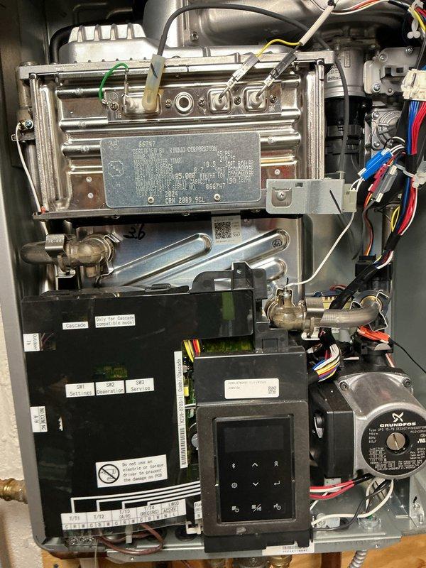 Completed first-year maintenance on combination boiler system, including inspection of heat exchanger, burner assembly, and Grundfos circulation pump. Verified proper operation of control board, digital interface, and all electrical connections. Cleaned ventilation filter and confirmed all mechanical components are functioning within manufacturer specifications.