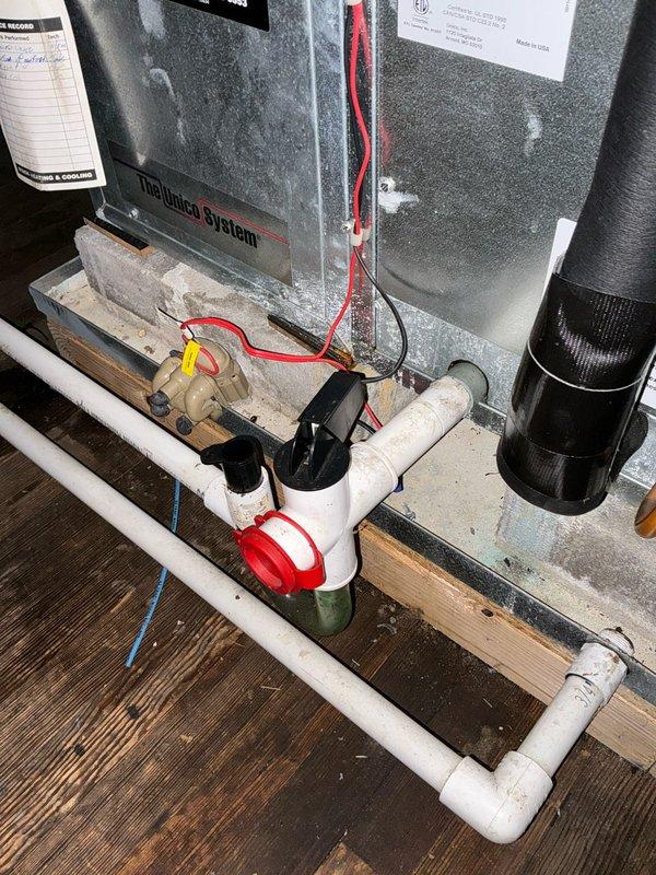 Conducted on-site evaluation of existing Unico HVAC system for replacement estimate following report from another contractor indicating system failure. Property contains two boilers with current Unico system requiring assessment. Inspected mechanical room installation including unit base, PVC condensate drainage configuration with multiple connections and fittings, electrical wiring connections, and brass valve components. Evaluated attic space installation including ductwork routing, flexible duct connections, and reflective insulation materials. Documented equipment condition, existing infrastructure, and spatial considerations for potential system replacement options. Provided homeowner with comprehensive replacement recommendations based on current system configuration and mechanical space limitations.
