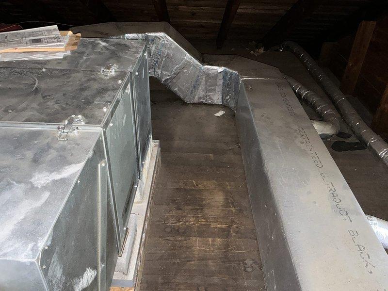 Conducted on-site evaluation of existing Unico HVAC system for replacement estimate following report from another contractor indicating system failure. Property contains two boilers with current Unico system requiring assessment. Inspected mechanical room installation including unit base, PVC condensate drainage configuration with multiple connections and fittings, electrical wiring connections, and brass valve components. Evaluated attic space installation including ductwork routing, flexible duct connections, and reflective insulation materials. Documented equipment condition, existing infrastructure, and spatial considerations for potential system replacement options. Provided homeowner with comprehensive replacement recommendations based on current system configuration and mechanical space limitations.