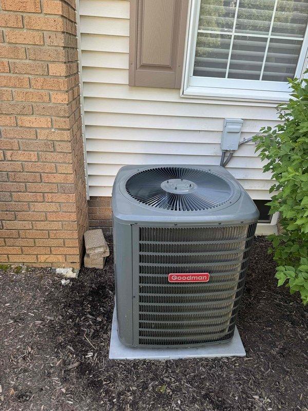 # HVAC Maintenance Summary

Completed scheduled preventive maintenance on a residential Goodman brand cooling system. Performed comprehensive inspection of the outdoor condensing unit, which was found to be in good working condition with proper placement on concrete pad and adequate clearance from surrounding structures. Conducted detailed examination of the evaporator coil assembly and refrigerant line connections, verifying proper installation and system integrity. All components inspected showed normal wear patterns consistent with regular operation. System documented photographically for maintenance records.