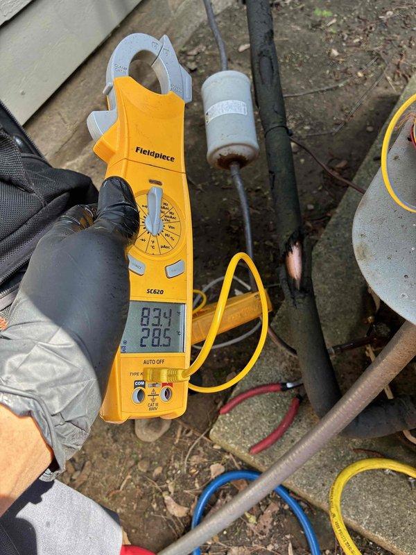 # HVAC Maintenance Service Completed

Performed comprehensive cooling system maintenance on two outdoor HVAC units as part of routine preventive maintenance program. Conducted electrical diagnostics using calibrated clamp meter, measuring amperage draw and voltage readings to verify proper compressor and fan motor operation. All electrical connections were inspected and found secure with appropriate wire routing maintained.

Inspected outdoor condensing units including compressor, condenser coil, and electrical control components. Verified proper refrigerant pressures and system performance parameters. Examined mounting hardware, refrigerant line connections, and electrical conduit for secure installation and proper weatherproofing. Both systems operating within manufacturer specifications with no deficiencies noted requiring immediate attention.