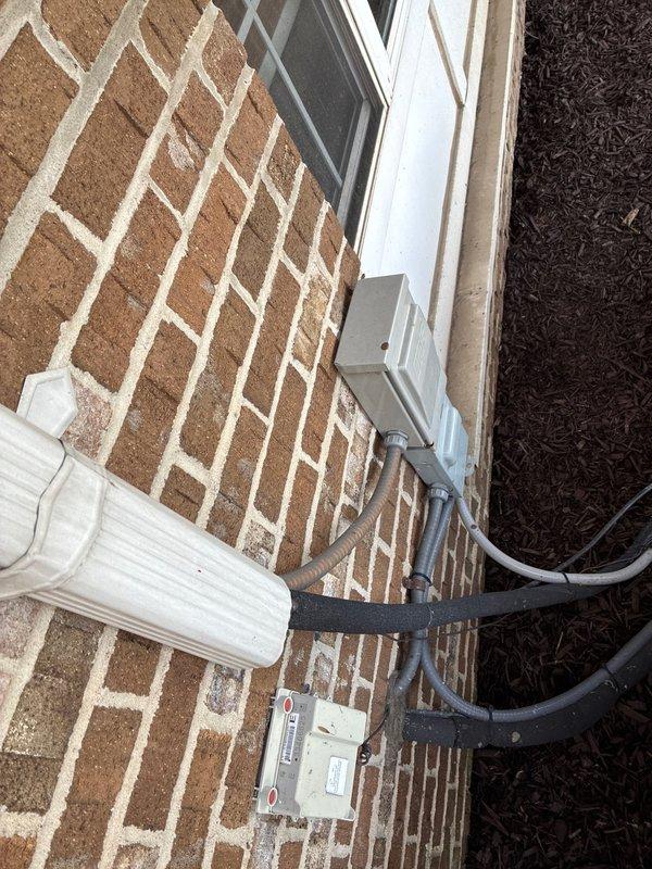 Evaluated existing HVAC system located in third-floor attic space for replacement options. Documented current gas furnace and air handler configuration, including internal components, blower assembly, control board wiring, and gas valve connections. Assessed exterior condensing unit disconnect and refrigerant line routing along building foundation to provide comprehensive replacement recommendations.