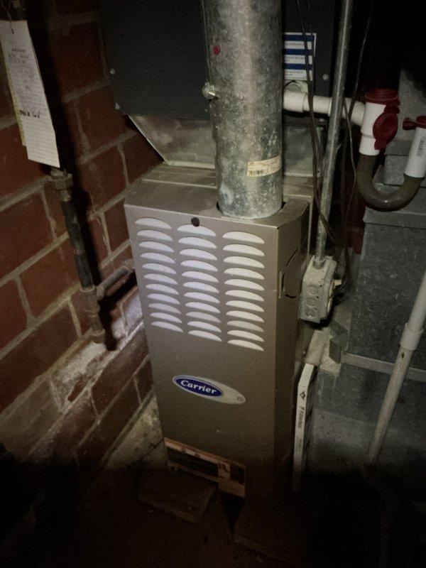 Performed comprehensive cooling system maintenance on residential Carrier HVAC unit. Inspected furnace assembly, ductwork connections, and associated components including Aprilaire humidifier control system. Verified proper operation of all mechanical systems, checked air filter condition, and confirmed gas valve assembly and electrical connections were secure. All equipment found operating within normal parameters with no issues identified.