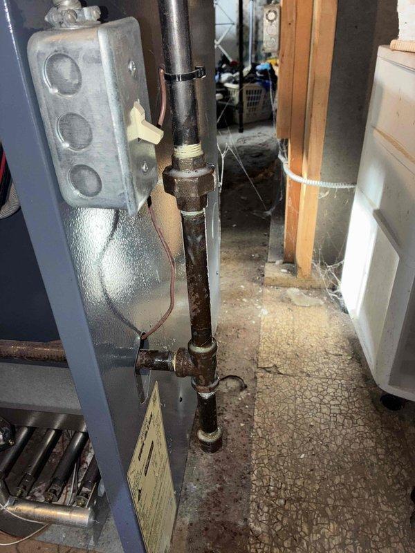 Completed annual preventative maintenance on ductless split heat pump system as part of routine service program. Inspected flame sensor and ignition components, finding normal dust accumulation consistent with system age; verified proper operation of heating elements and control panel indicators. Assessed associated piping and connections, noting surface oxidation on black iron piping that does not affect system performance, and confirmed all mechanical components, brackets, and mounting assemblies are secure and functioning within manufacturer specifications.