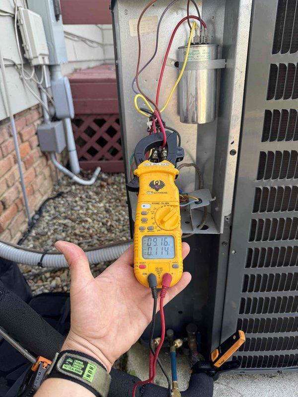 Responded to customer concern regarding potential hail damage to air conditioning system. Performed comprehensive system inspection including electrical diagnostics with multimeter testing of capacitor and contactor components, which showed normal operating values. Inspected evaporator coil and condensate drain pan, finding significant accumulation of organic debris including leaves and twigs that required documentation. All electrical connections and refrigerant lines were visually inspected and found intact with no evidence of storm-related damage to exterior unit or internal components.