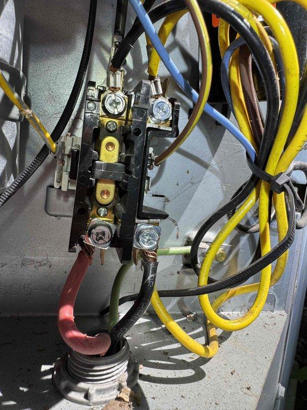 Performed comprehensive cooling system maintenance on residential HVAC unit. Inspected electrical connections at terminal block, verifying all wire terminations were secure and properly torqued. Examined refrigerant line insulation for integrity and signs of wear. Replaced air filter and confirmed proper fitment within air handler compartment. All electrical components showed normal operating condition with connections properly secured and organized. System operational and ready for cooling season.