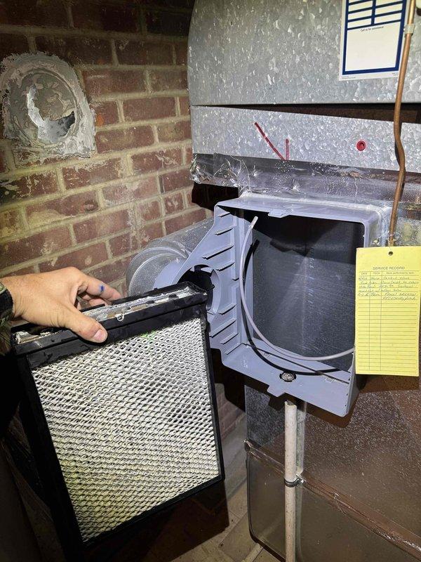 Performed comprehensive cooling system maintenance on residential HVAC unit. Inspected electrical connections at terminal block, verifying all wire terminations were secure and properly torqued. Examined refrigerant line insulation for integrity and signs of wear. Replaced air filter and confirmed proper fitment within air handler compartment. All electrical components showed normal operating condition with connections properly secured and organized. System operational and ready for cooling season.