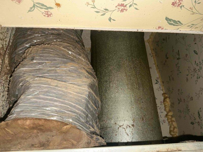 Responded to no heat call and performed comprehensive assessment of existing furnace system. Documented current HVAC infrastructure including flexible and rigid ductwork configuration in attic space and basement plenum connections. Evaluated condition of existing distribution system, noting accumulated dust and wear on flexible ductwork components. Photographed sheet metal transitions and support structures to assess compatibility with replacement equipment. Provided customer with furnace replacement options based on existing duct configuration and system requirements.