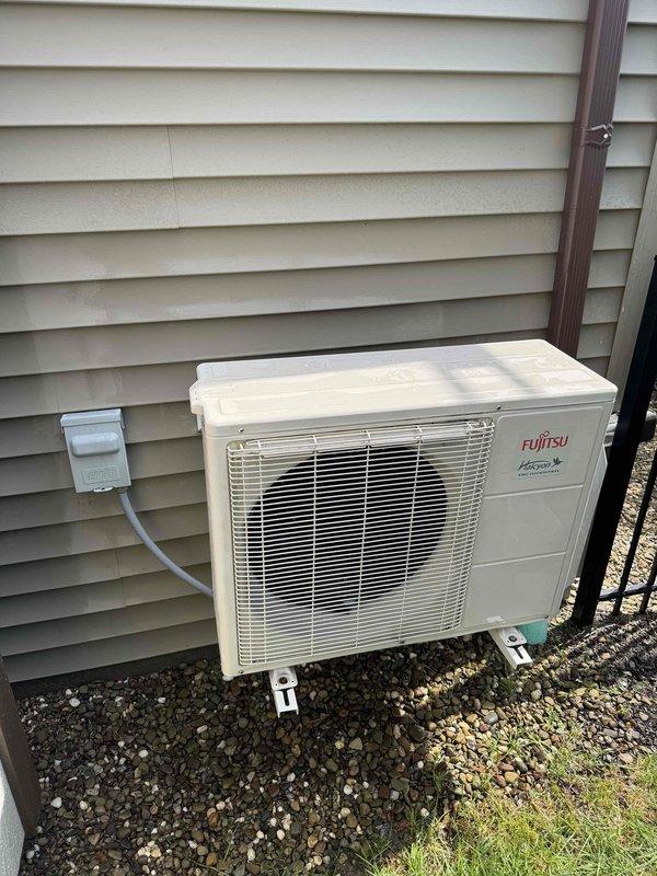 Responded to no-cooling complaint for Fujitsu Halcyon mini-split system installed in garage. Upon arrival, found outdoor condenser unit in good physical condition with no visible damage to exterior components or coil fins. Indoor air handler was operational but not providing adequate cooling to space. Performed diagnostic evaluation of system, checked refrigerant levels, electrical connections, and thermostat settings to identify cause of cooling failure and restore proper operation to the unit.