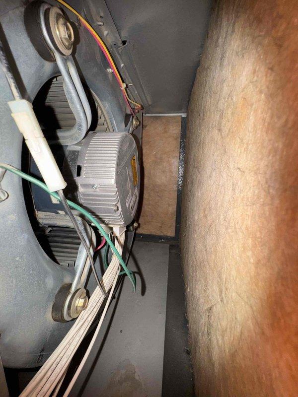 Performed comprehensive tune-up on residential HVAC system and discovered severe ice buildup on evaporator coil assembly, indicating restricted airflow or potential refrigerant issues requiring immediate attention. Inspected outdoor condenser unit and documented significant leveling concerns with unit leaning precariously toward radon mitigation system, creating potential safety hazard and compromising operational efficiency. Recommended corrective action for both frozen evaporator coil and condenser leveling to restore proper system function and prevent equipment damage.