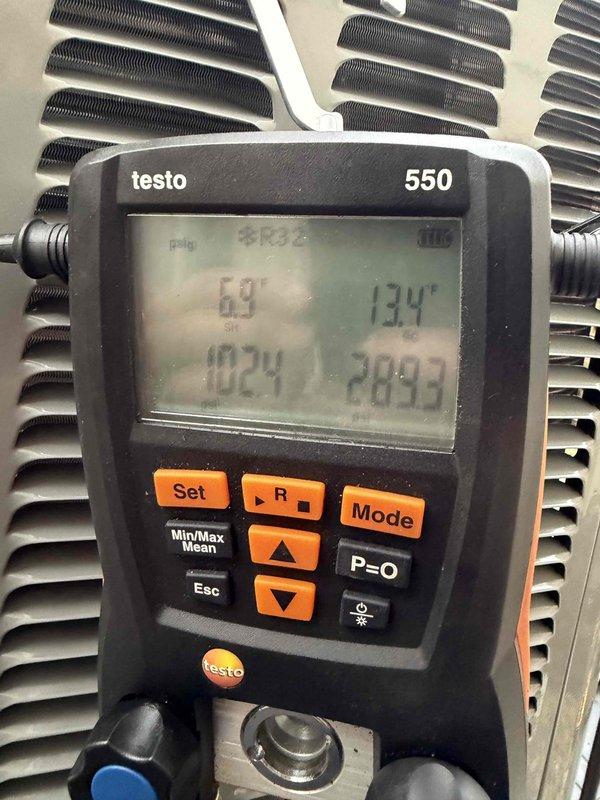 Completed warranty inspection and refrigerant charge on newly installed HVAC system. Verified system pressures using calibrated digital gauges, recording readings of 69 psig on high side and 13.4 inHg on low side, with superheat at 24.6°F and subcooling at 92.1°F. System charged to manufacturer specifications and operating within normal parameters.