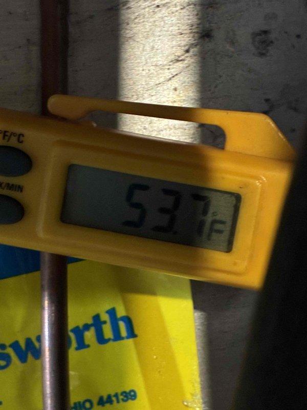 Completed installation of new air conditioning system. Installed and wired ECM motor control board with proper electrical connections and verified system initialization. Confirmed proper refrigerant line temperatures with copper piping reading 57°F at suction line, indicating adequate system performance and refrigerant charge.