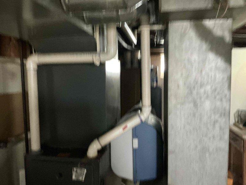 Conducted comprehensive estimate for complete HVAC system replacement in residential basement mechanical room. Evaluated existing Goodman furnace installation, associated condensate drainage system with PVC piping, electrical service connections, and overall equipment layout to provide customer with full system replacement options including furnace, air conditioning unit, and necessary accessories.