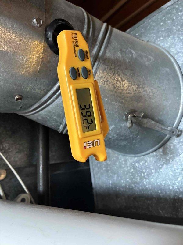 Completed scheduled preventive maintenance on residential cooling system. Performed comprehensive system inspection including temperature diagnostics, measuring supply air temperature at 37.3°F at the evaporator coil assembly. Observed moderate dust and debris accumulation on return air grille and interior louvers, indicating normal system usage since last service interval. All mechanical components operating within manufacturer specifications at time of inspection.