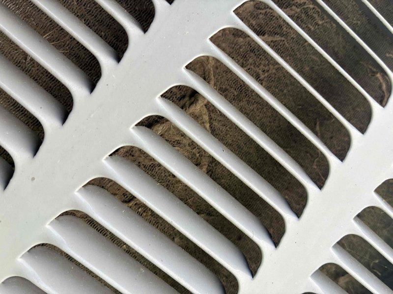 Completed scheduled preventive maintenance on residential cooling system. Performed comprehensive system inspection including temperature diagnostics, measuring supply air temperature at 37.3°F at the evaporator coil assembly. Observed moderate dust and debris accumulation on return air grille and interior louvers, indicating normal system usage since last service interval. All mechanical components operating within manufacturer specifications at time of inspection.
