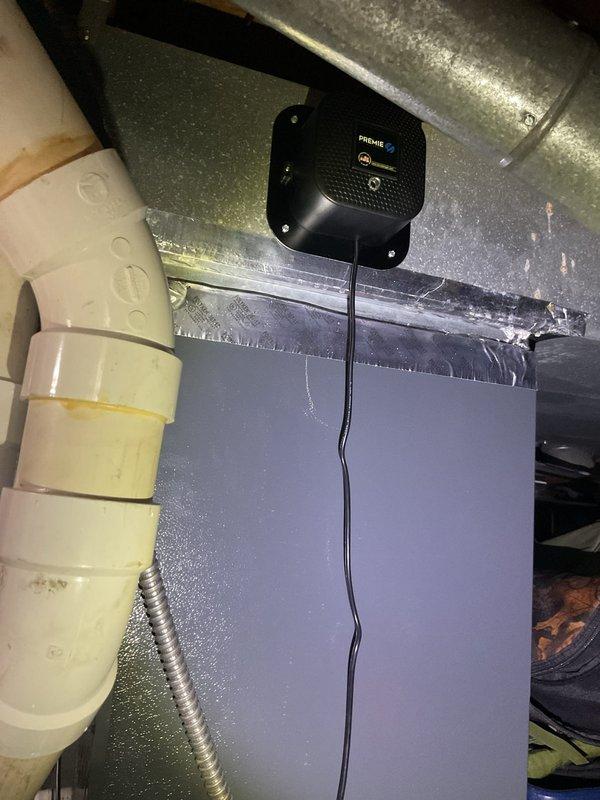 Performed comprehensive preventive maintenance on residential HVAC cooling system located in basement mechanical room. Inspected gray furnace unit with associated white PVC condensate piping and metal flue vent connections, verifying all joints and elbows for proper sealing and drainage. Evaluated ductwork system including galvanized metal supply and return runs, confirming structural integrity and identifying minor dust accumulation. Utilized Fieldpiece diagnostic equipment to measure system performance parameters and verify operational efficiency. All equipment found to be in satisfactory working condition with no immediate repairs required.